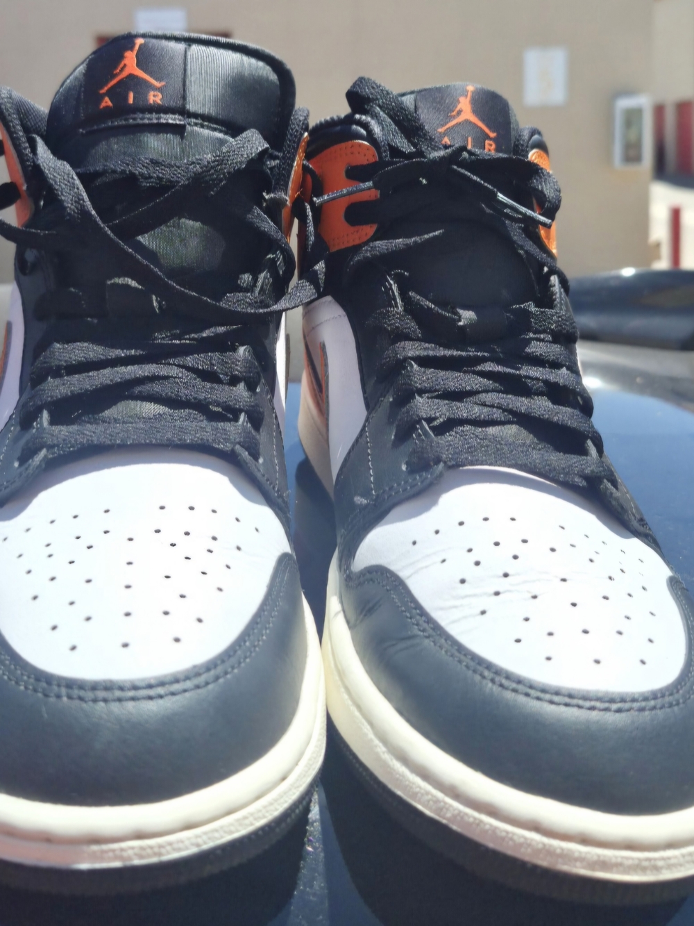 Jordan Men’s High-Top Sneakers in Black, White & Orange Accents